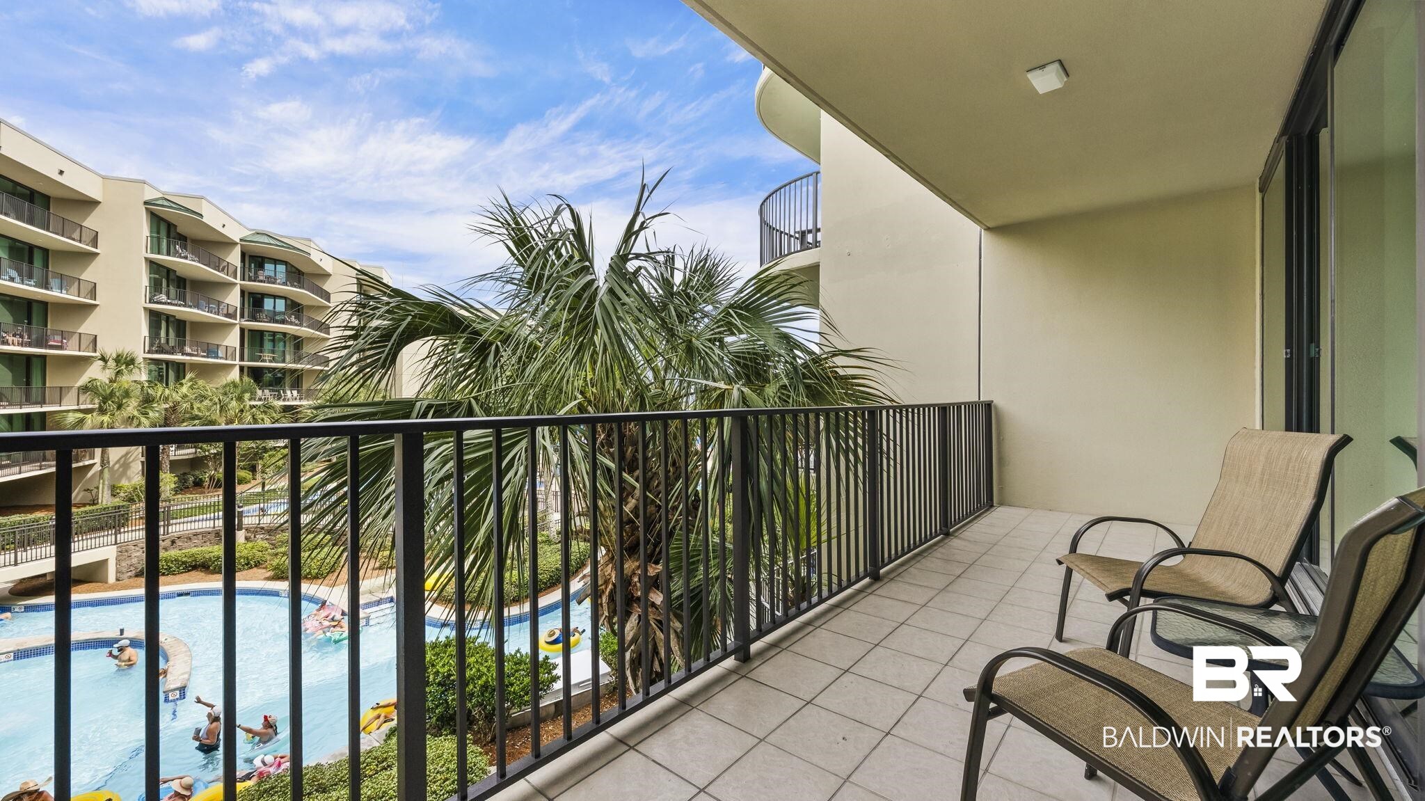 27580 Canal Road, Unit 1213 Orange Beach, AL 36561 - Photo 19 of 27 Private balcony featuring textured tile flooring, black metal railings, and an exterior wall finish