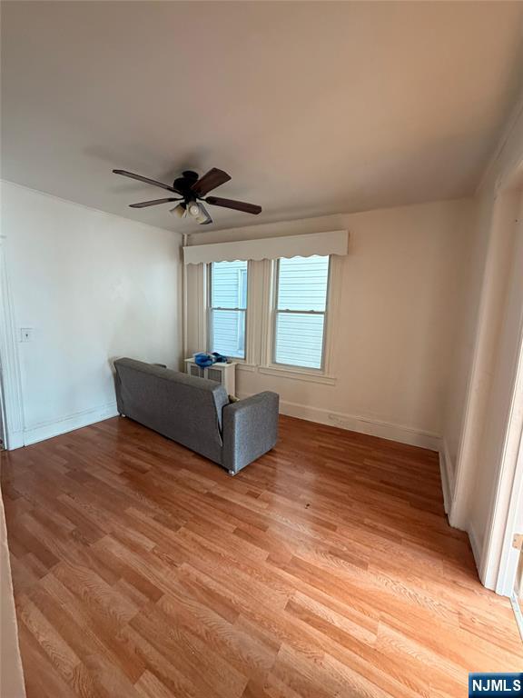 113 Martin Street, Unit 1 Paterson, NJ 07501 - Photo 13 of 14 a living room with a bed furniture and a window