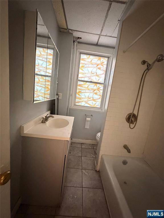 113 Martin Street, Unit 1 Paterson, NJ 07501 - Photo 14 of 14 a bathroom with a bathtub a sink and a shower