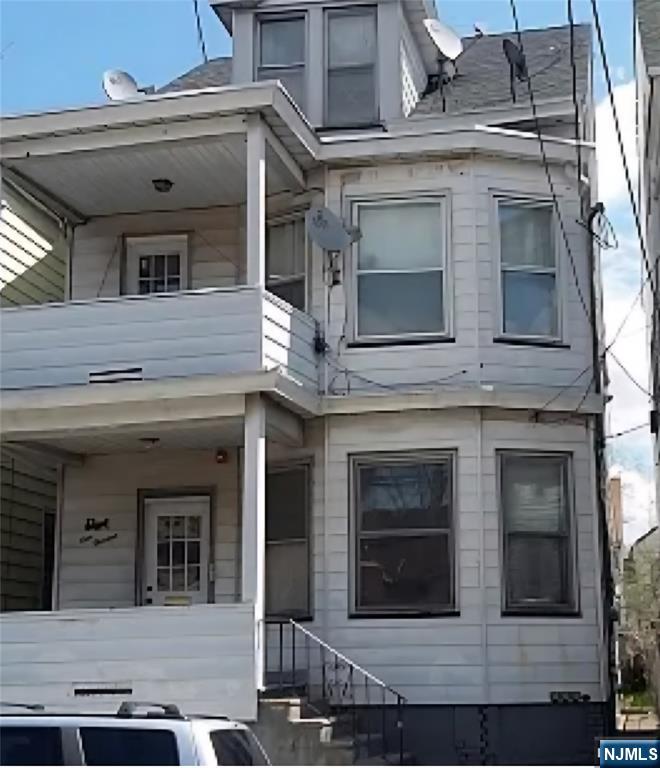 113 Martin Street, Unit 1 Paterson, NJ 07501 - Photo 3 of 14 a view of a white building