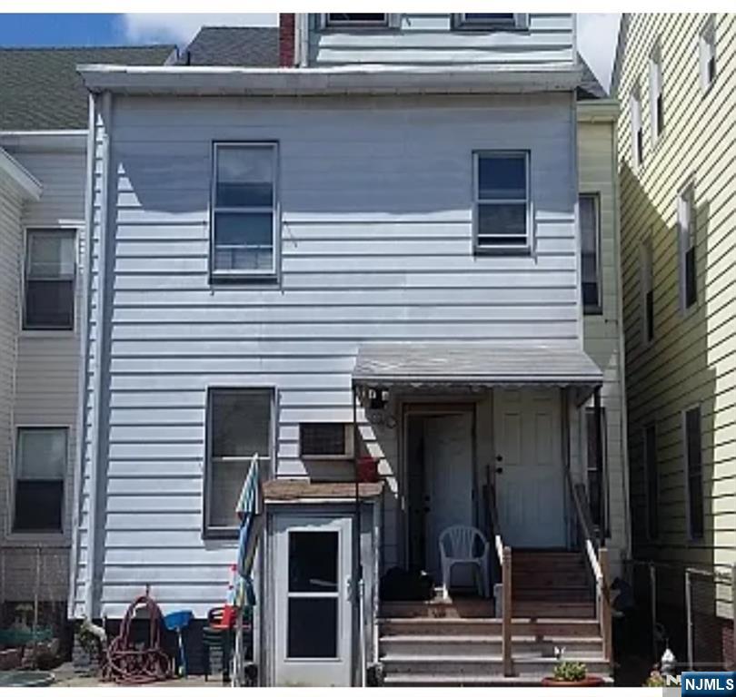113 Martin Street, Unit 1 Paterson, NJ 07501 - Photo 5 of 14 a view of a house with a door