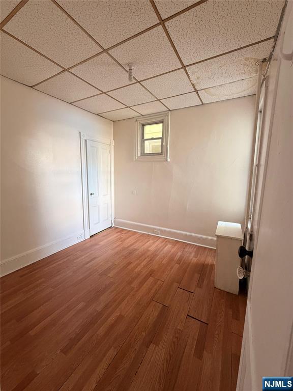 113 Martin Street, Unit 1 Paterson, NJ 07501 - Photo 6 of 14 a view of empty room with wooden floor