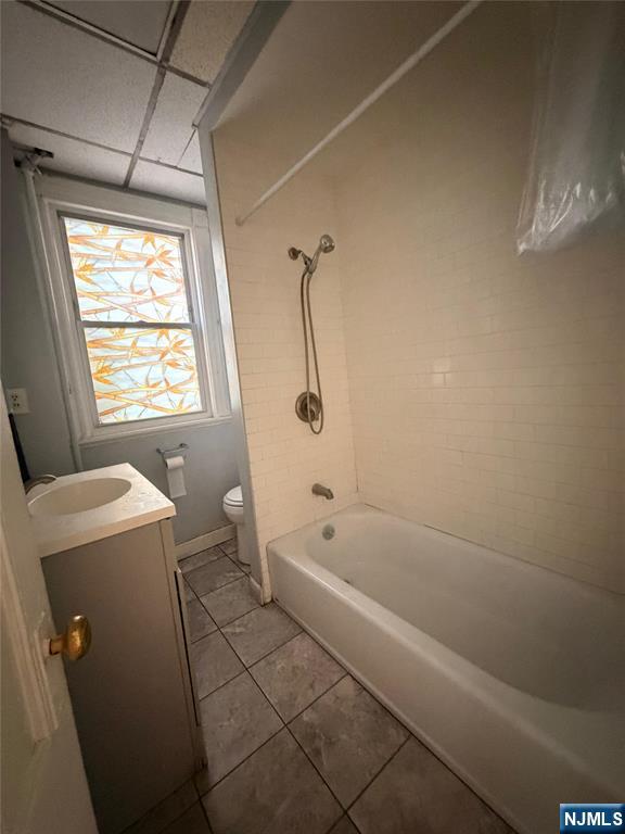 113 Martin Street, Unit 1 Paterson, NJ 07501 - Photo 7 of 14 a bathroom with a bathtub a window and a shower