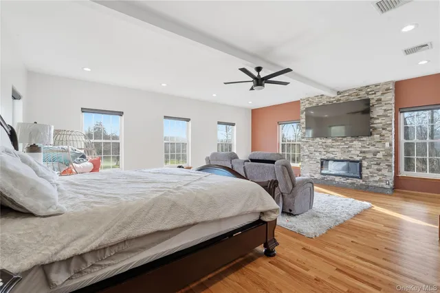 a bedroom with a bed and a fireplace