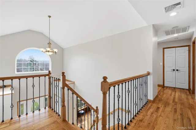 a view of a hallway with windows
