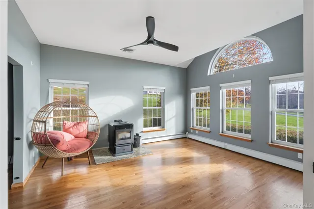 a view of a livingroom with furniture window and wooden floor