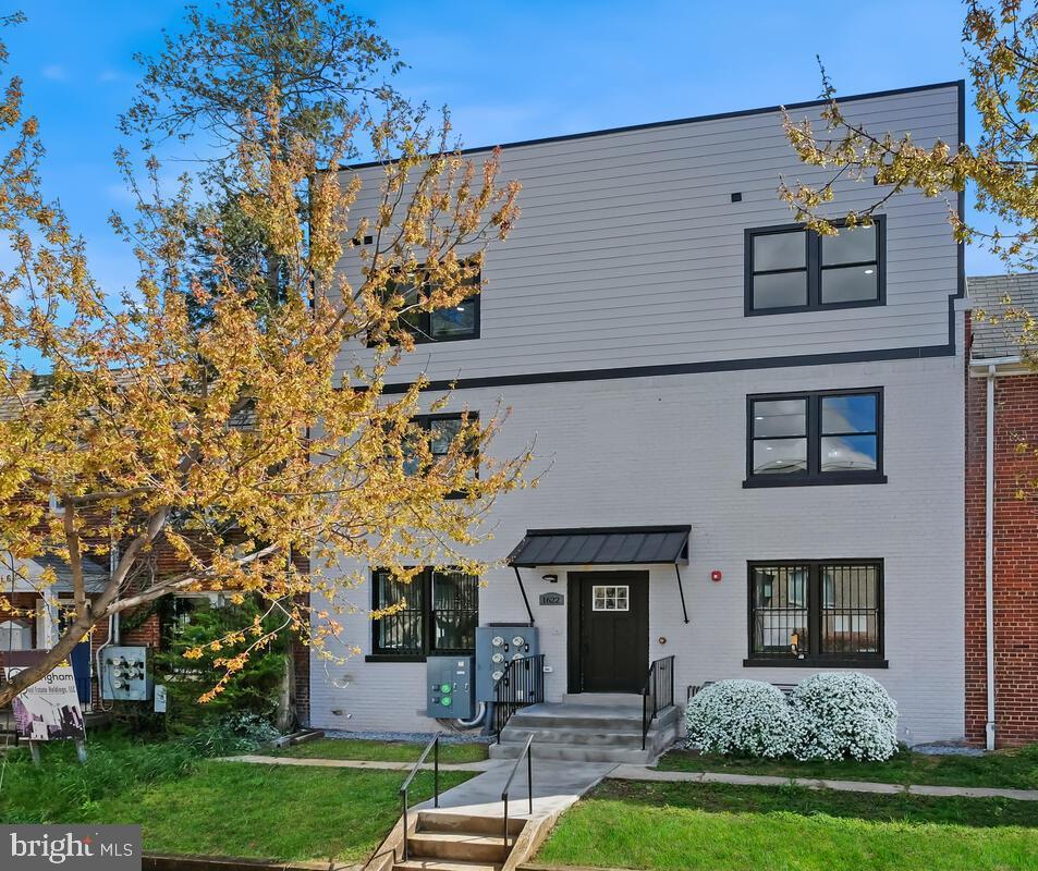1622 17th Street Southeast, Unit 2001 Washington, DC 20020 - Photo 1 of 11 front view of a house with a yard