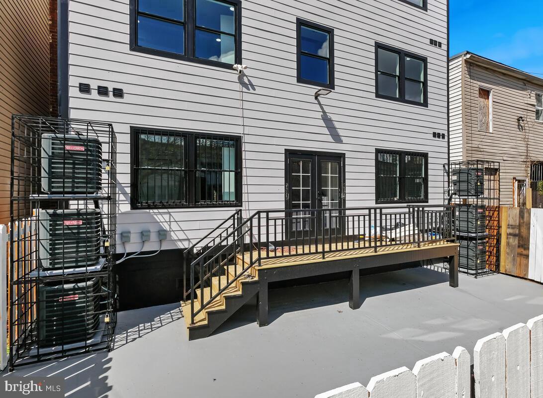 1622 17th Street Southeast, Unit 2001 Washington, DC 20020 - Photo 9 of 11 a balcony with furniture and a potted plant