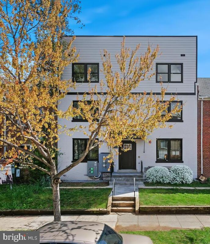 1622 17th Street Southeast, Unit 2001 Washington, DC 20020 - Photo 10 of 11 front view of a house with a small yard