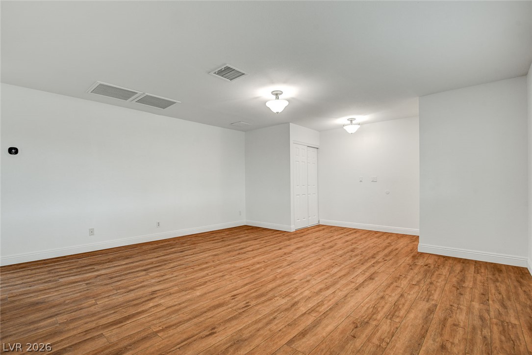 1810 Pinto Road Henderson, NV 89002 - Photo 11 of 53 Wood-look flooring and clean white walls offer a versatile foundation for any aesthetic.