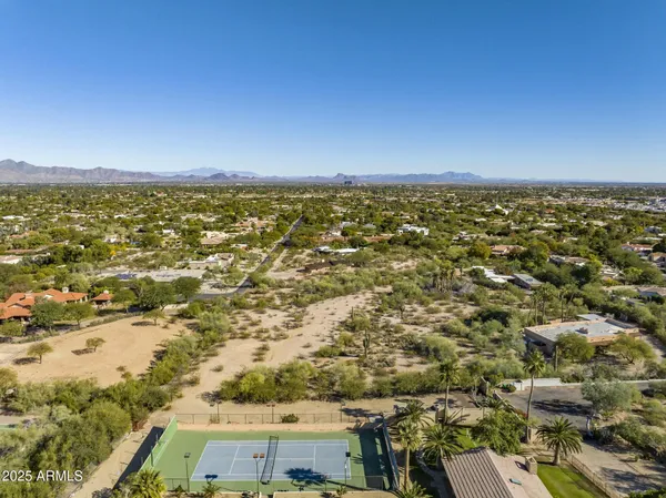 an aerial view of residential building and ocean