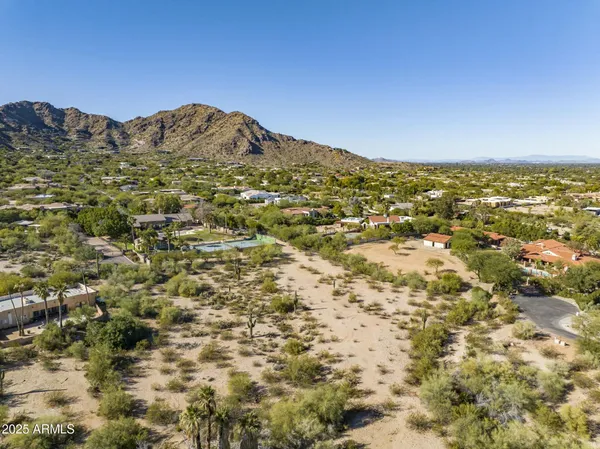 a view of a large mountain with mountains in the background
