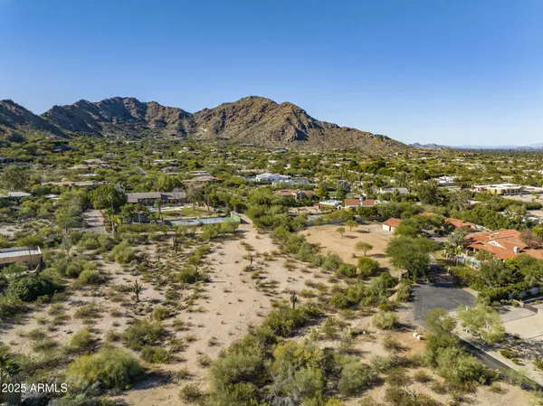 view of a dry yard with wooden fence