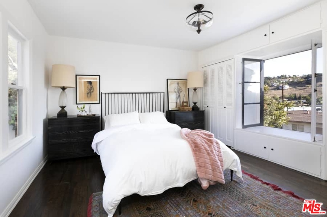 3729 Roderick Road Los Angeles, CA 90065 - Photo 14 of 40 a bed sitting in a bedroom next to a window