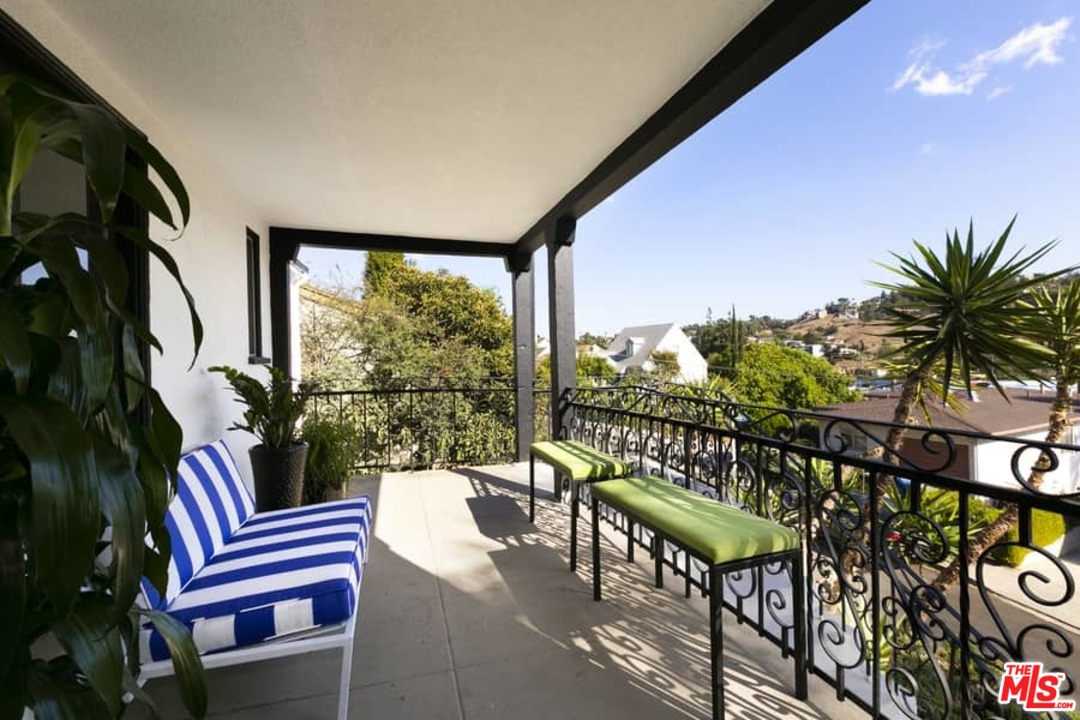 3729 Roderick Road Los Angeles, CA 90065 - Photo 4 of 40 a view of a chairs and table in patio with wooden floor