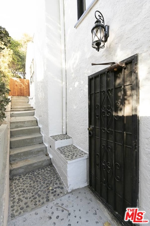 3729 Roderick Road Los Angeles, CA 90065 - Photo 34 of 40 a bathroom with a toilet and shower