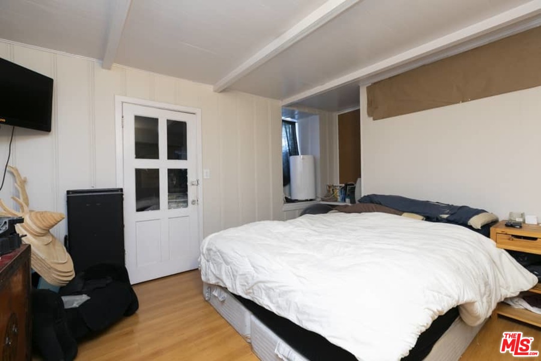 3729 Roderick Road Los Angeles, CA 90065 - Photo 40 of 40 a bedroom with a bed and flat screen tv