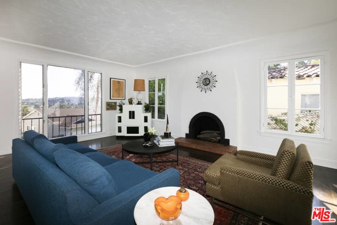 3729 Roderick Road Los Angeles, CA 90065 - Photo 6 of 40 a living room with furniture fireplace and a large window