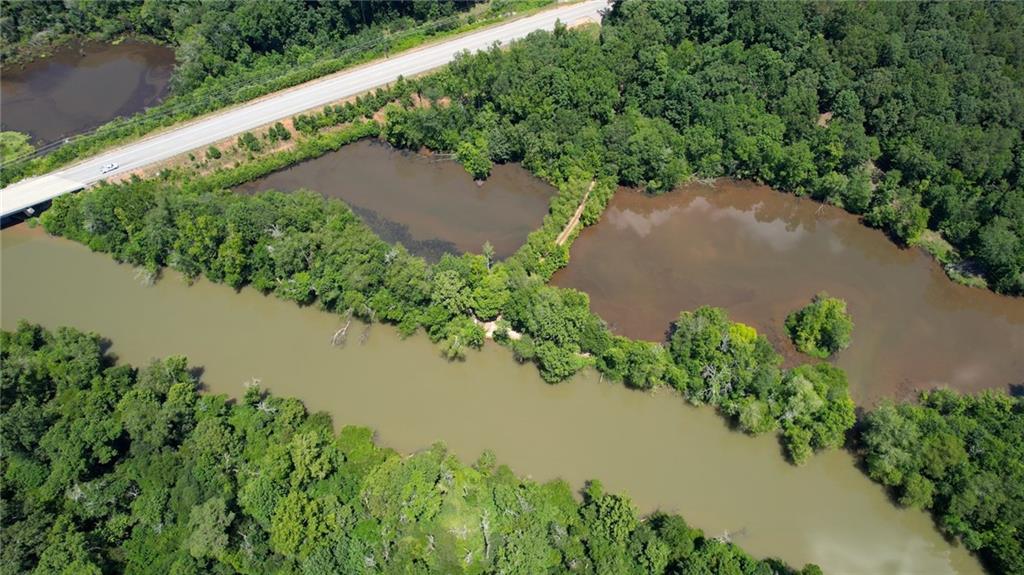 16653 Highway 36 Covington, GA 30014 - Photo 16 of 54 an aerial view of a house with a yard and a lake view