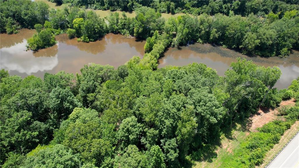 16653 Highway 36 Covington, GA 30014 - Photo 2 of 54 an aerial view of a house with a yard and lake view