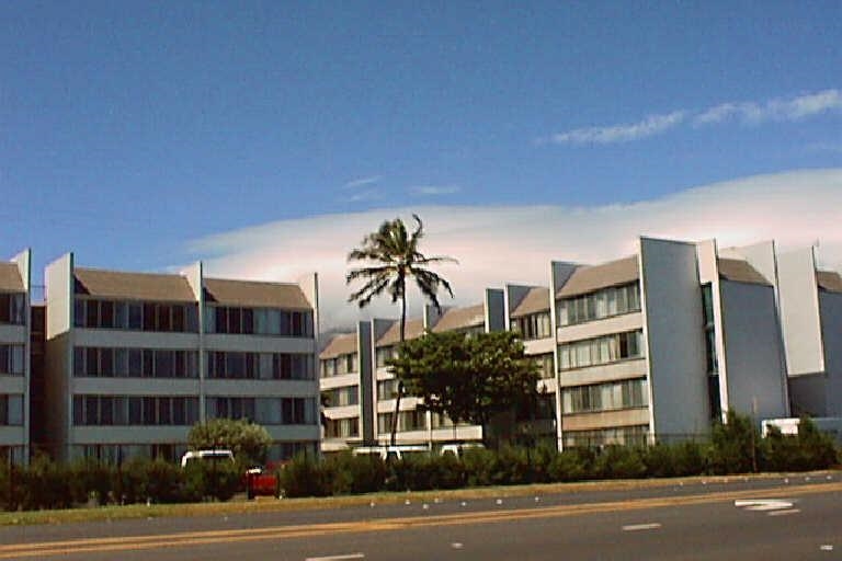 a view of a building with a street