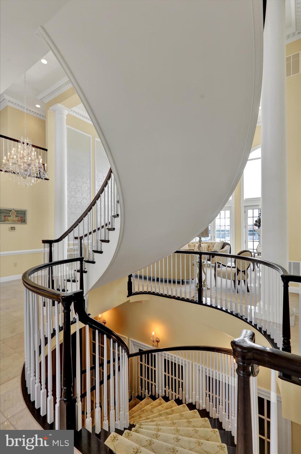 1000 Bluestone Drive Lititz, PA 17543 - Photo 27 of 132 a view of staircase with lots of frames on wall and wooden floor