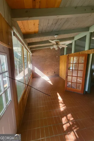 a view of empty room with windows