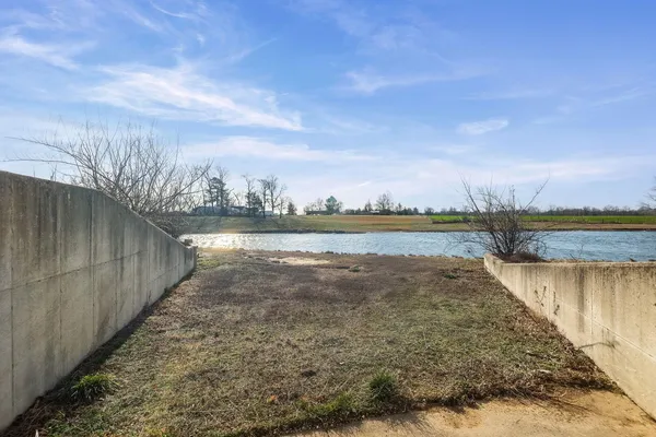 a view of a lake with houses in the back