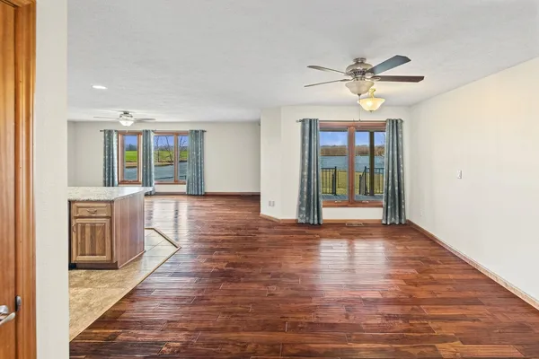 a view of an entryway with wooden floor
