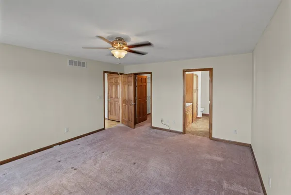 a view of empty room with windows