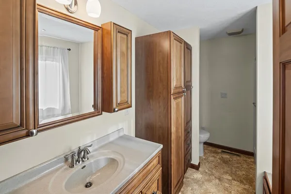 a bathroom with a sink and a mirror
