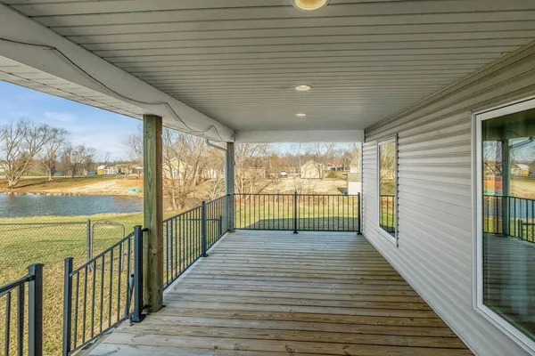 a view of a porch with wooden floor