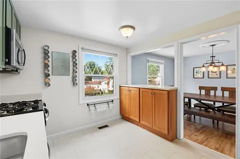 a view of kitchen with windows and furniture