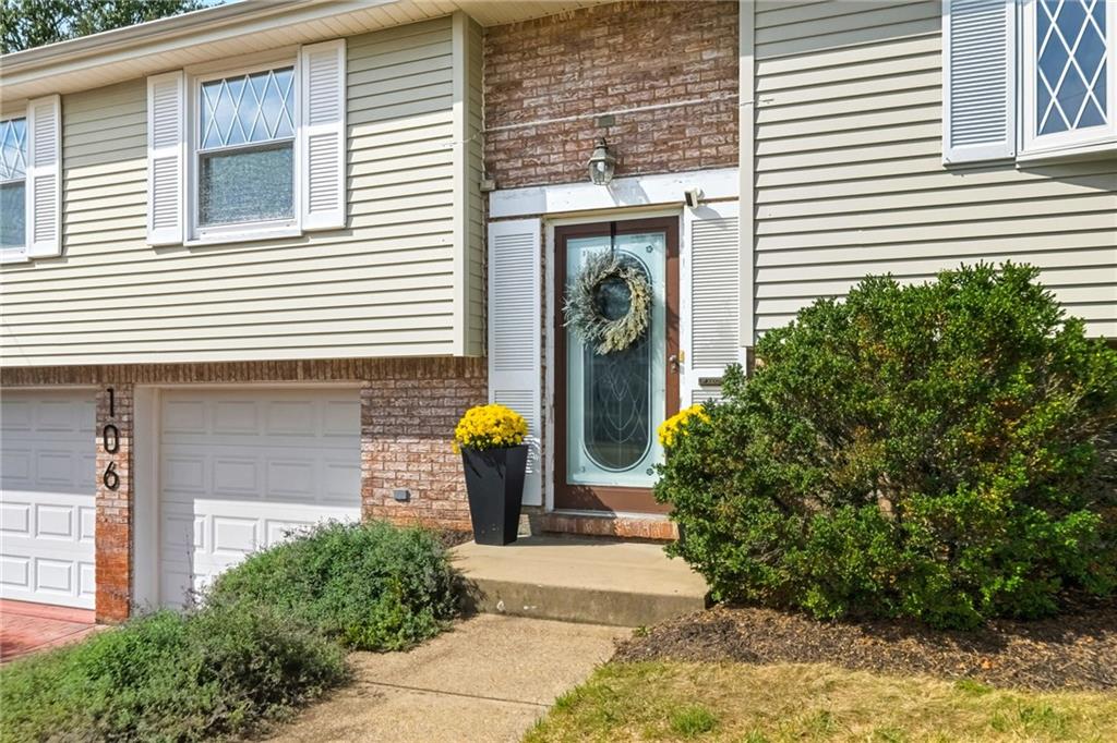 106 Kings Point Road Glenshaw, PA 15116 - Photo 2 of 49 a front view of a house with a garden