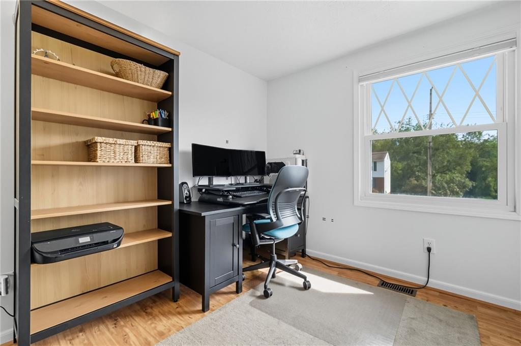 106 Kings Point Road Glenshaw, PA 15116 - Photo 23 of 49 a view of workspace with wooden floor windows