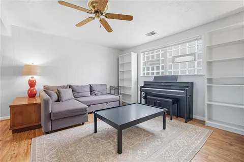 a living room with furniture and a window