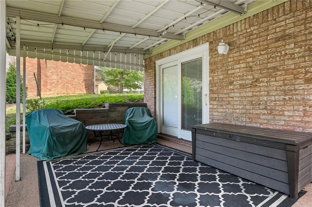 106 Kings Point Road Glenshaw, PA 15116 - Photo 35 of 49 a view of a chairs and table in the patio