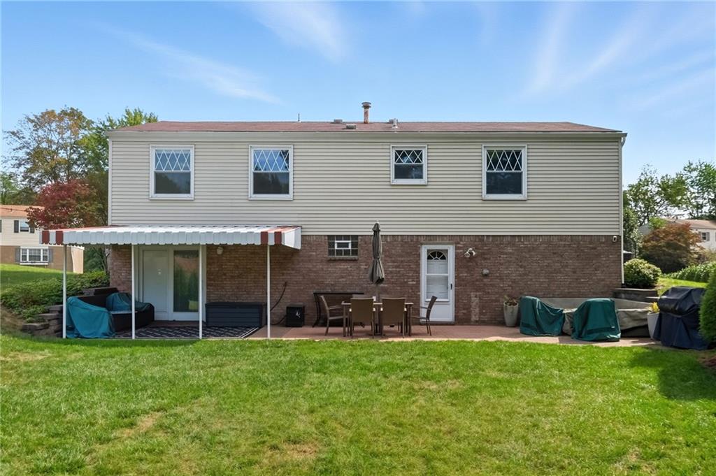 106 Kings Point Road Glenshaw, PA 15116 - Photo 39 of 49 a front view of a house with a garden
