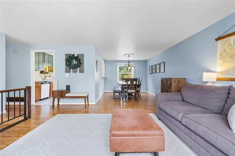 a living room with furniture and a table