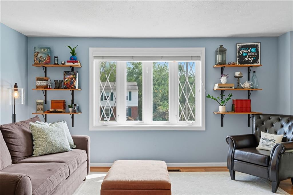 106 Kings Point Road Glenshaw, PA 15116 - Photo 7 of 49 a living room with furniture and a window