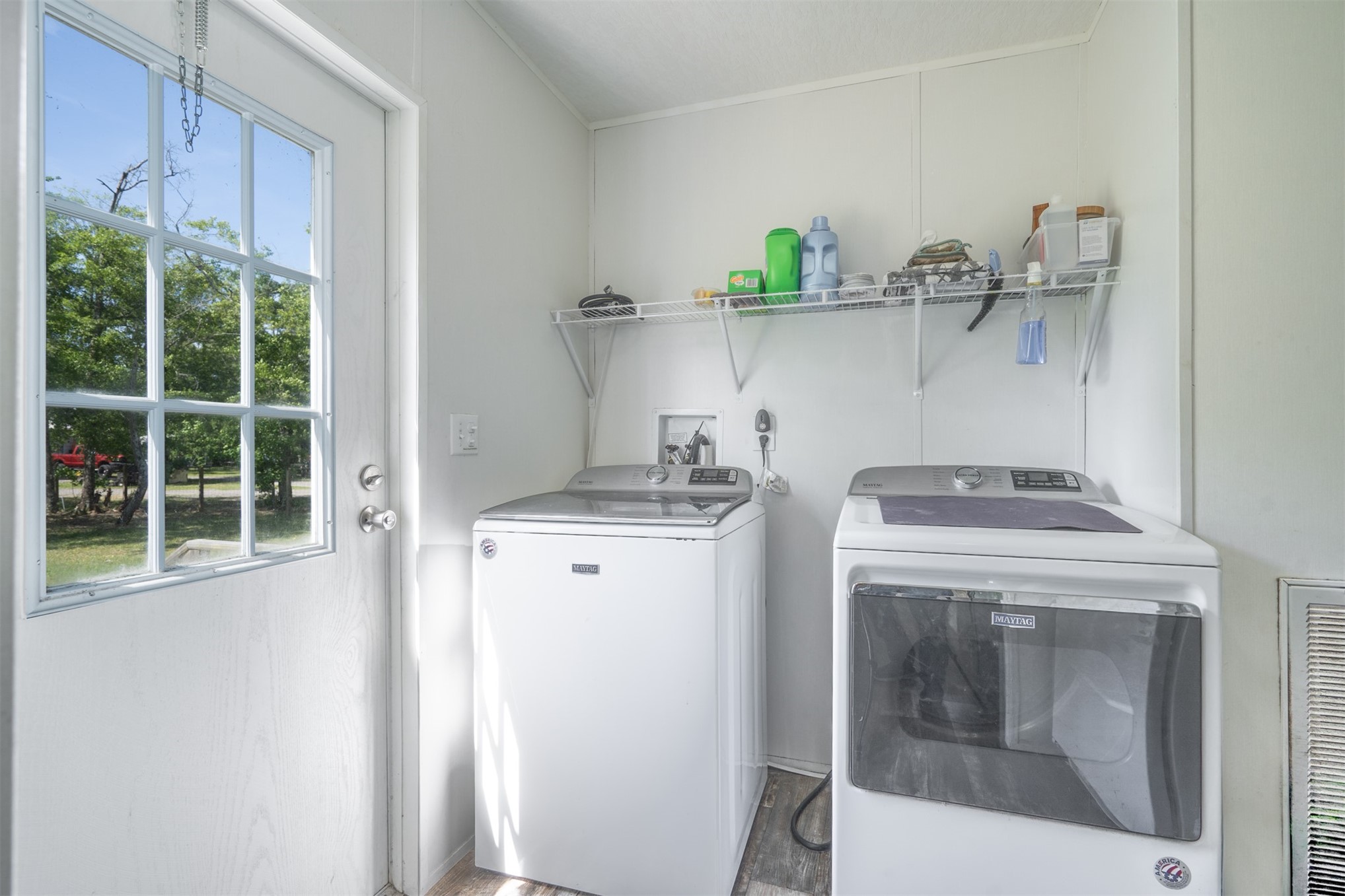 76220 Dove Road Yulee, FL 32097 - Photo 27 of 48 a view of storage and utility room with washer and dryer