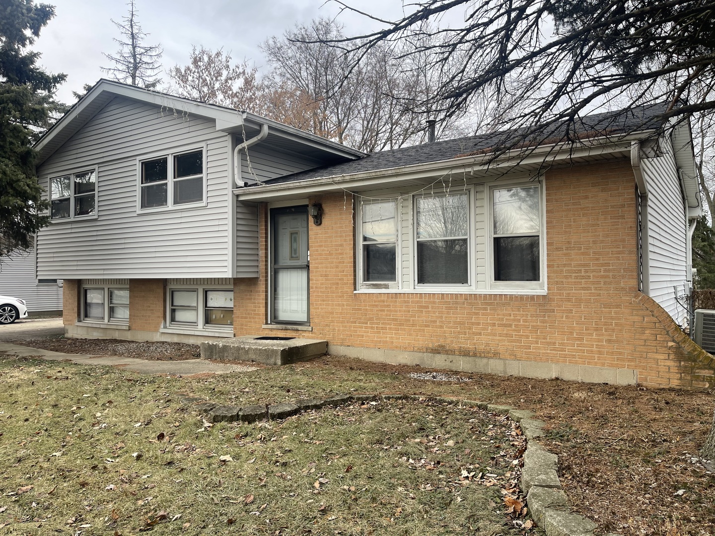 5S345 North Naperville Wheaton Road Naperville, IL 60563 - Photo 2 of 8 a front view of a house with a garden