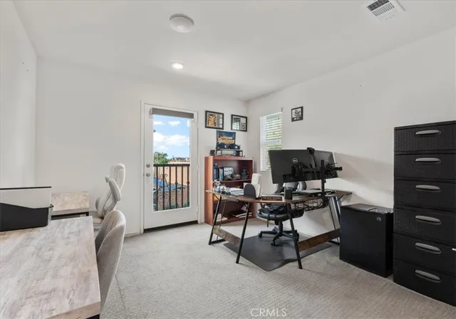 a view of a house with backyard and trees