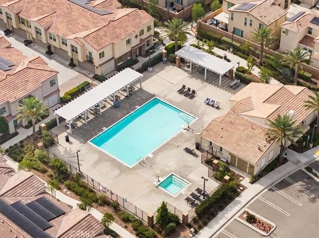 an aerial view of a house with a yard and wooden floor