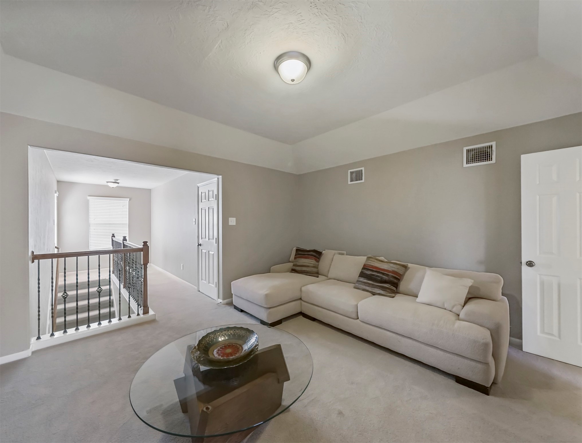 8214 Garrison Point Drive Houston, TX 77040 - Photo 23 of 37 a living room with furniture and a wooden floor