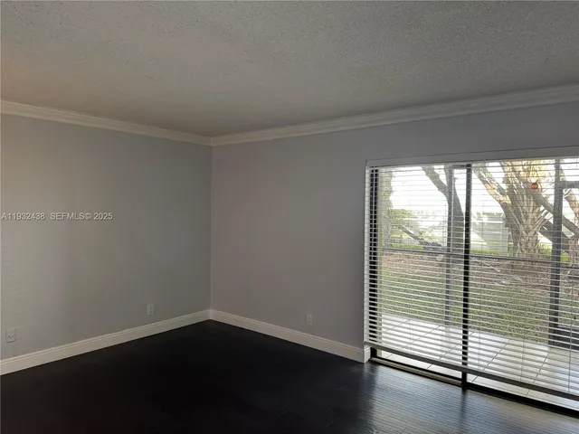 a bathroom with a granite countertop sink a toilet a mirror and shower