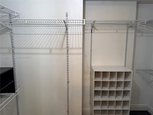 a white toilet sitting next to a bath tub and a shower