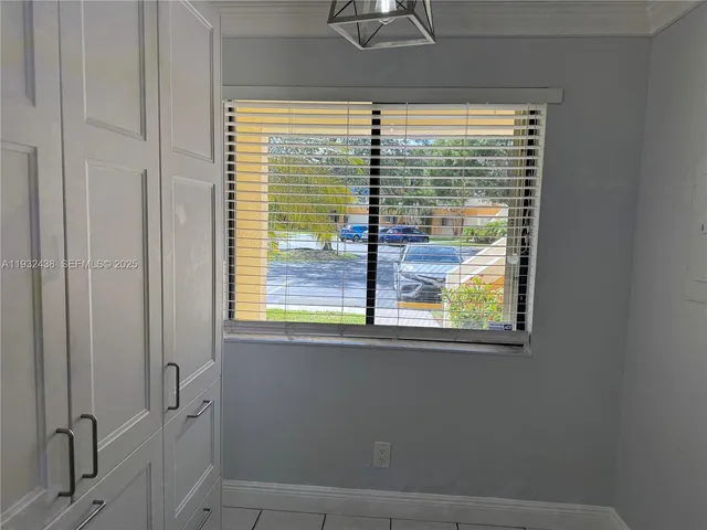 a view of street and trees in the background