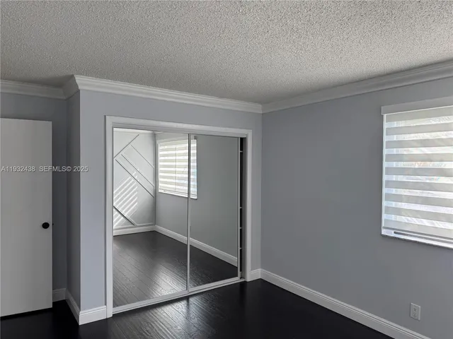an empty room with wooden floor