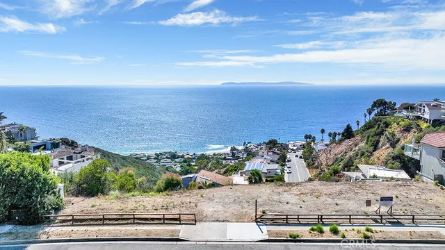 a view of building with an ocean
